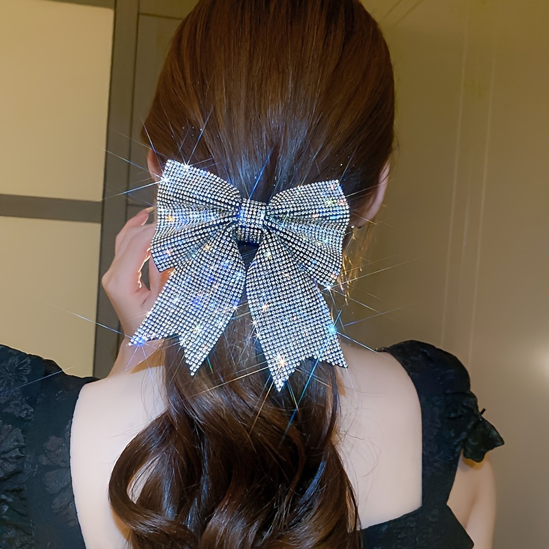 

A Pair Of Japanese And Korean Style Hair Clips With Exaggerated Bows And Diamonds