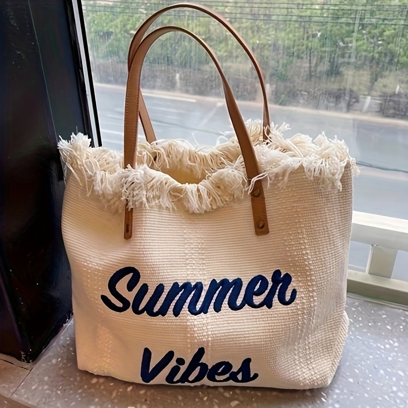 

Grand Sac Fourre-Tout en Toile 'Vibes d'Été' avec Lettrage Brodé et Accents de Pompons - Sac à Épaule de Plage Décontracté Blanc/Noir pour Femmes