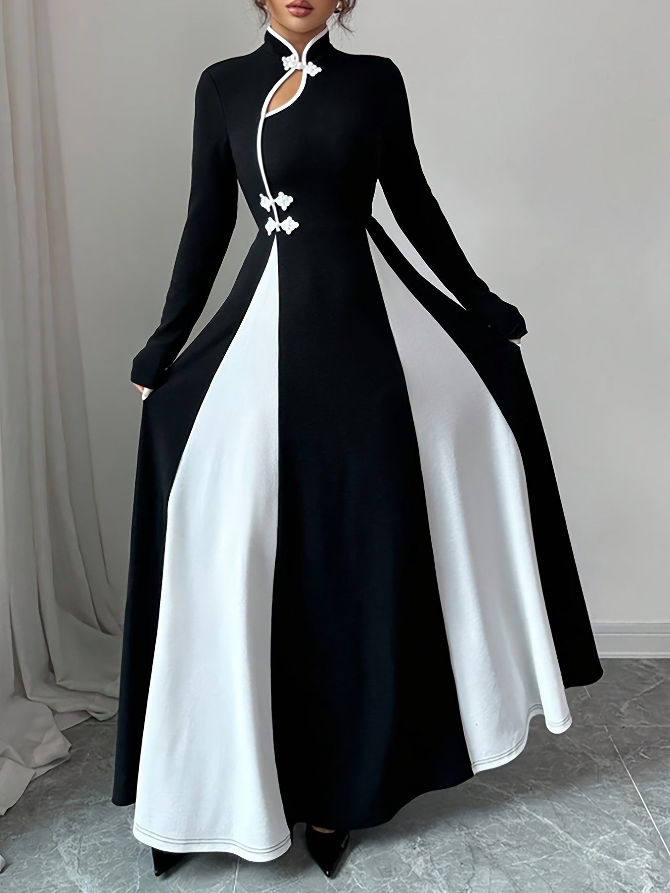 This Elegant And Refined Long Dress Features a Chinese-Style Stand Collar with a Unique Asymmetrical Design, Combining Black And White Colors, Perfect for Daily Commutes And Dates