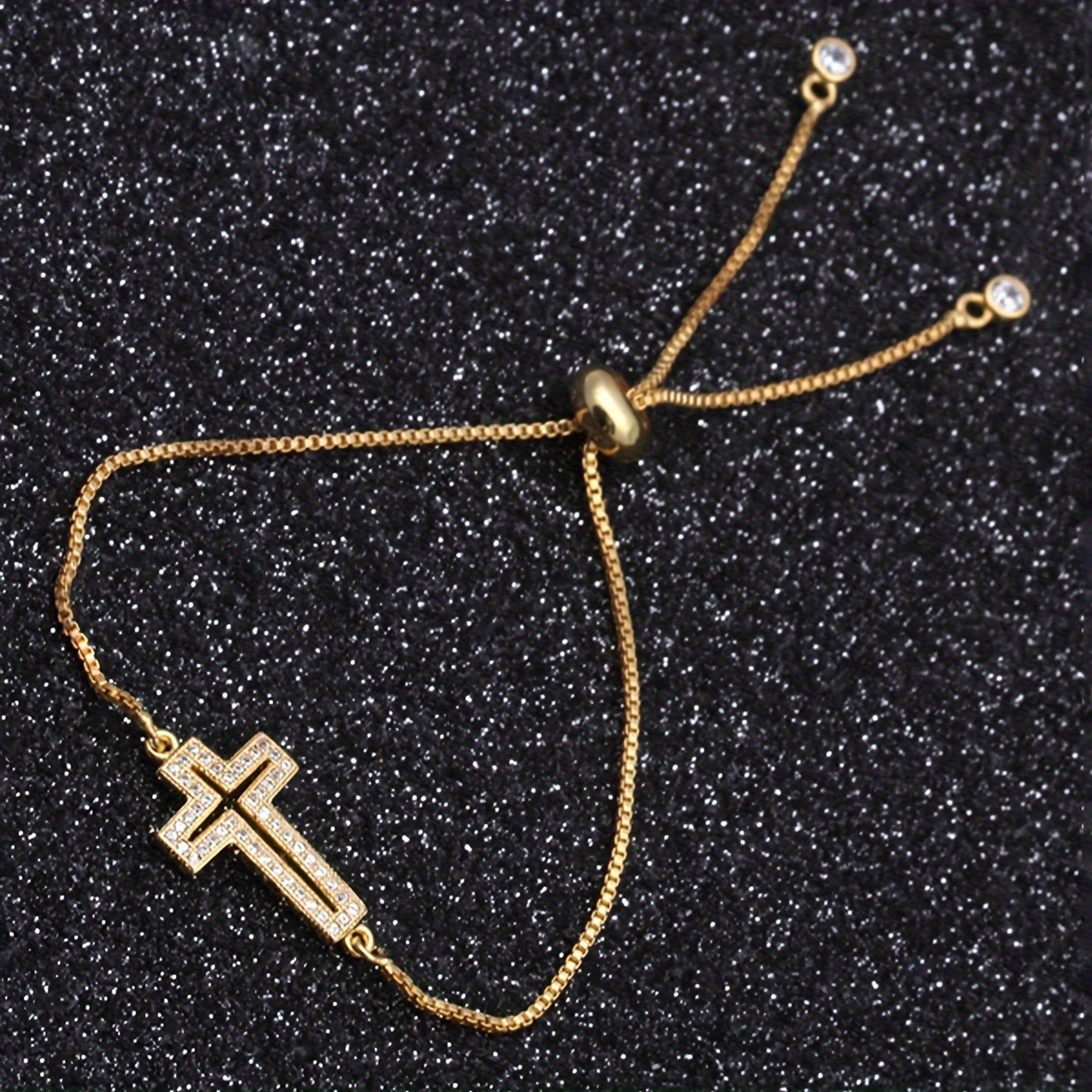 A Delicate Cross Pendant Bracelet With Adjustable Copper Setting And Zirconia, In A , A Versatile And Luxurious Gift Bracelet.