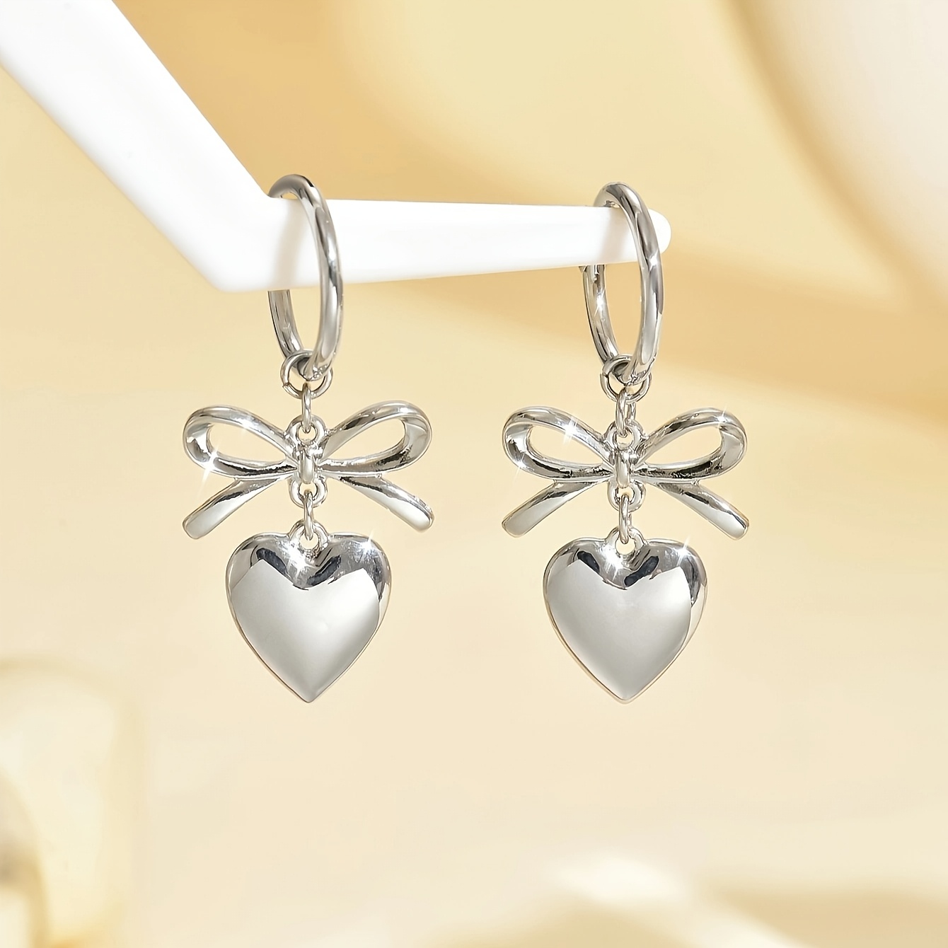 

A Pair Of Stylish Heart-shaped Knot Earrings For Women.