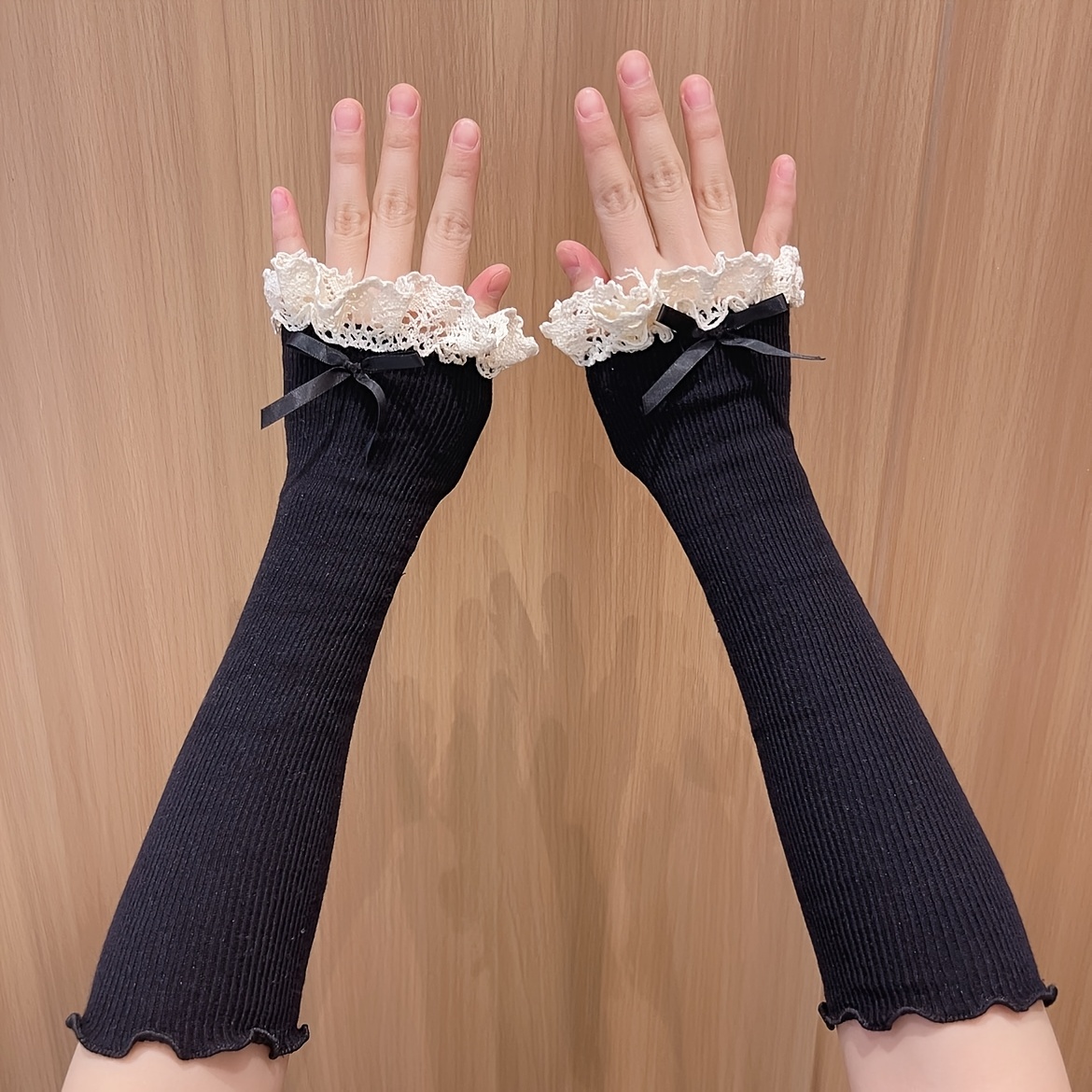 A Pair Of Women's Long Elastic Arm Sleeves With Bow Lace For
