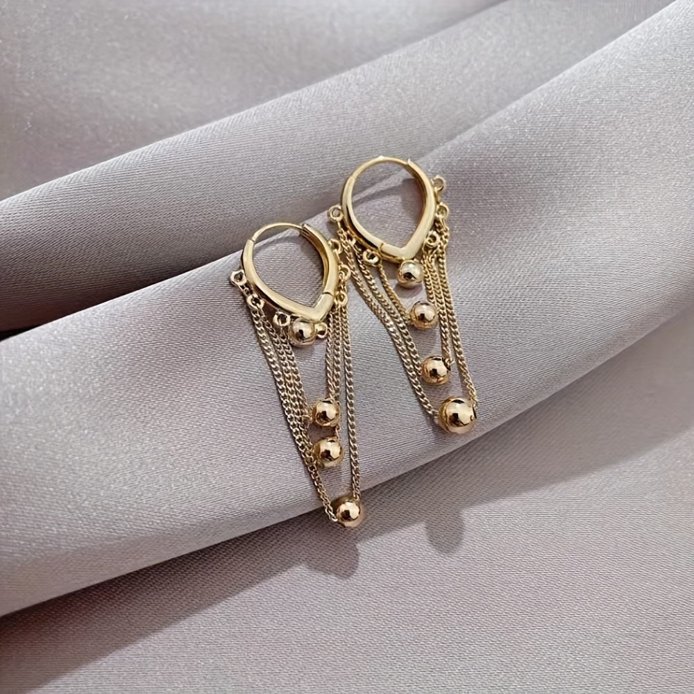 Stylish Tassel Earrings with Golden Sphere Pendant