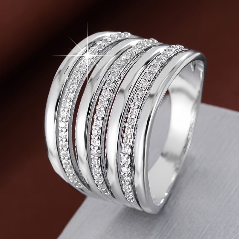 A Minimalist Wide Band Multi Layered Ring Inlaid