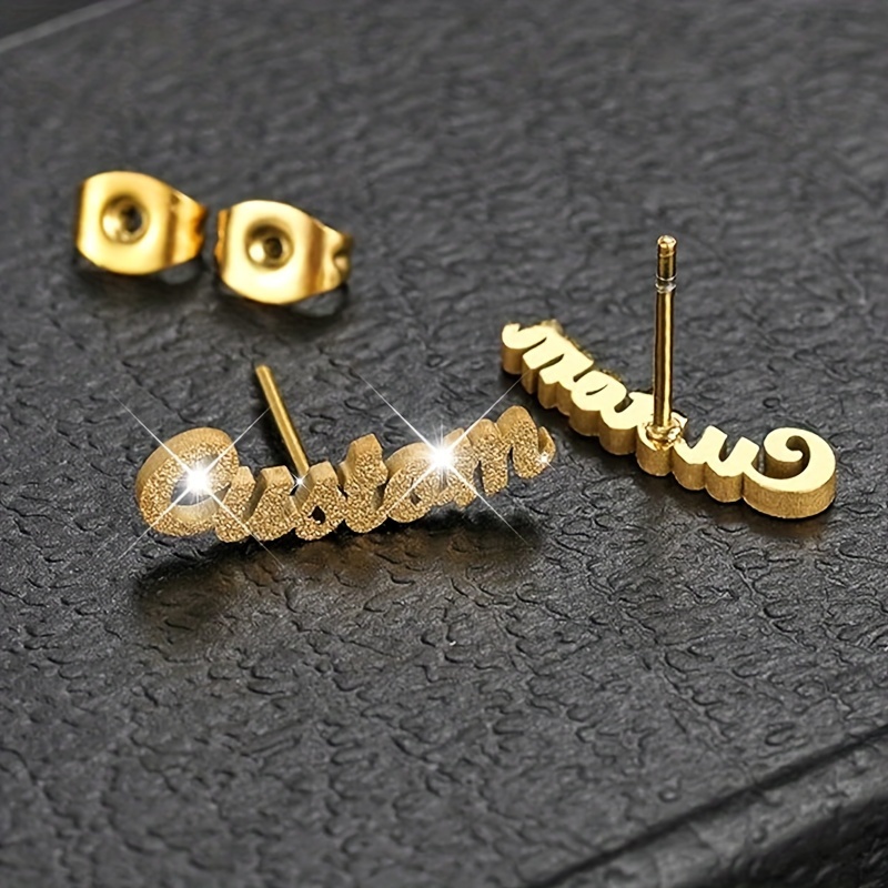 Customizable Three-dimensional Earrings With A Shiny Name Design, Made Of Stainless Steel. Minimalist Matte And Shiny Pieces Are Use And Make Great Unisex Gifts For Couples