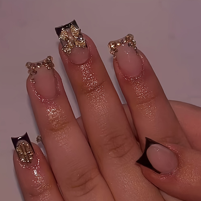 E-shop 24 Stück Mittelgroße Quadratische Press-On Falsche Nägel Schwarze Nagelspitzen mit Goldener Schleife Glitzerndem Glitzer-Dekor. Geeignet für