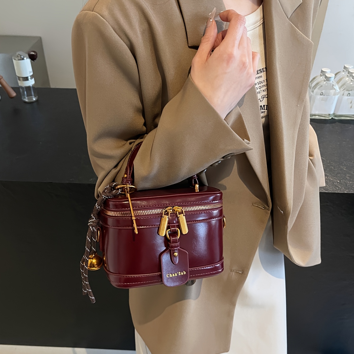 Elegant Retro Women's Crossbody Bag with Bell Pendant – Stylish Brown Handbag with Adjustable Strap, Zipper Closure, and Golden-Tone Hardware for Work, Date, Shop, and Party