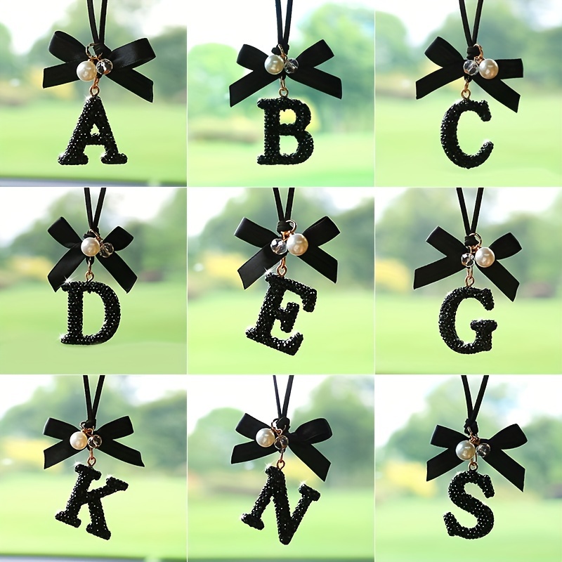 

Crystal Alphabet Letter Hanging Ornament With Bowknot And Faux Pearl Detail, Fashionable Decorative English Letter Charm For Vehicle Mirror Display