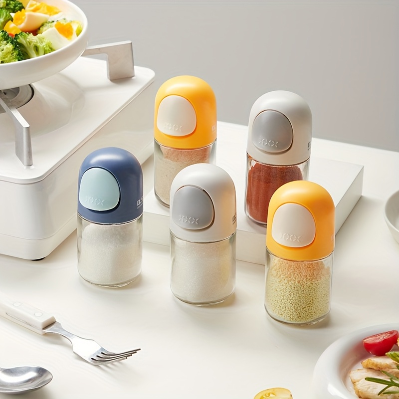 glass spice jar with precise dispenser push button controlled seasoning container anti   clear measurement cup for salt pepper herbs   countertop organizer ideal gift for home   chefs cooking essentials modern kitchenware   lid culinary enthusiasts Product details 1