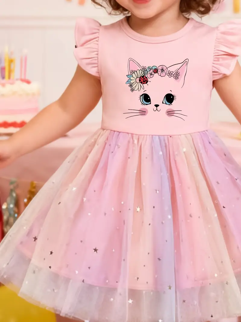 kitten pink dress Cute little kitten wearing a dress and socks laying on a pink table. Baby Scottish fold cat dressed up Stock Photo