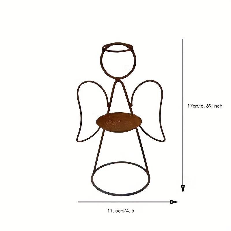 A Rusty Iron Angel-shaped Candle Holder: A Decorative Piece For The Christmas Holiday Atmosphere, Featuring Warm Light And Hollow Wings, Perfect For Romantic Settings On A Fireplace Or Dining Table