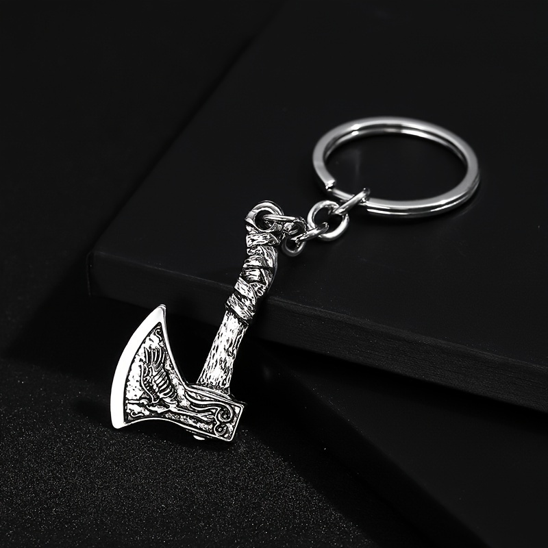 Image of A Trendy European And -style Keychain Pendant For Men, Shaped Like An Axe Without A Blade, With A Simple And , Perfect For Accessorizing Bags.
