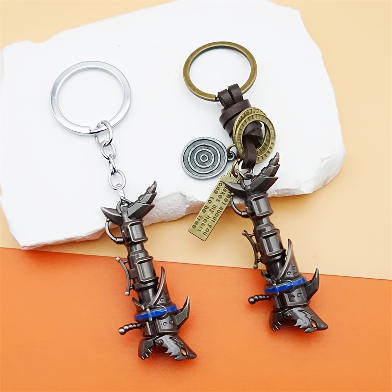 

1pc Fashionable Zinc Alloy Men's Keychain, Weapon Cannon Model Key Ring, Non-woven Game-themed Accessory, Ideal Gift For Fans And Christmas