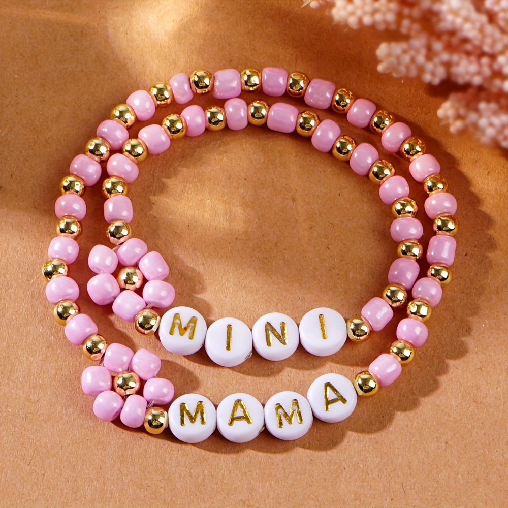 

2-piece Set "mama & Mini" Beaded Bracelets With Daisy Charm, Sweet Pinkish Woven Rice Beads, Matching Mother-baby Set, Perfect For Mother's Day/women's Day, Cute And Simple Style