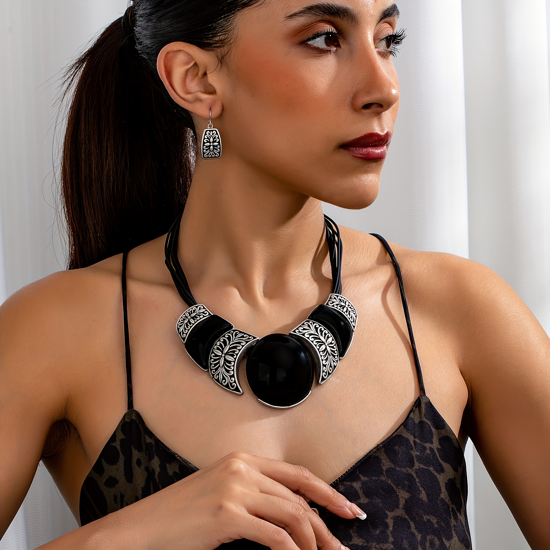 

A Necklace And A Pair Of Earrings Featuring A Vintage Bohemian Style With Exaggerated Black Geometric Patterns, Embossed Creative Multi-layered Fashion Jewelry Set For Women.