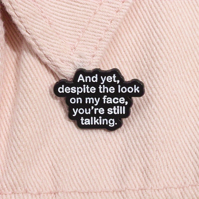 

1/2pcs "and Yet, Despite The Look On My Face, You're Still Talking" Quote Enamel Pin, Simple Style Black Brooch Lapel Badge, Humorous Jewelry Accessory For Bags & Clothing