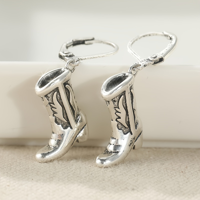 Image of Vintage Copper Cowboy Boot Earrings Are Small And Delicate, Featuring A Silvery End. Are Perfect For Fans Of Southwestern And Western Styles, As Well As Horse Enthusiasts
