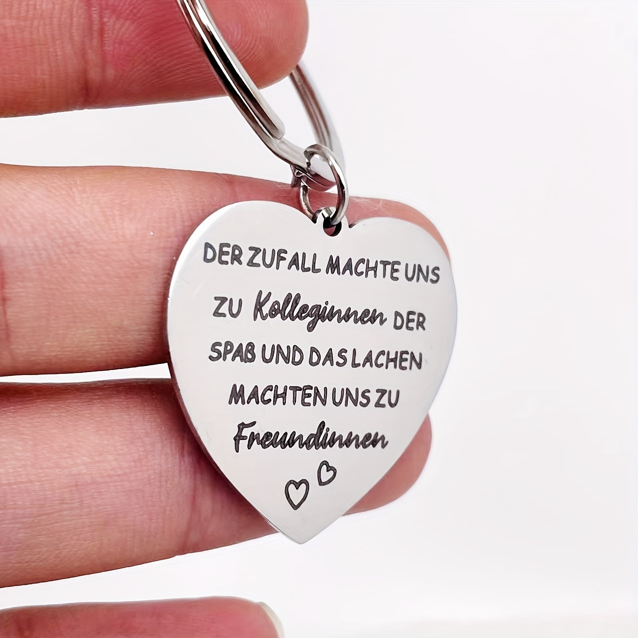A Keychain Gift Suitable For Colleagues And , In German.
