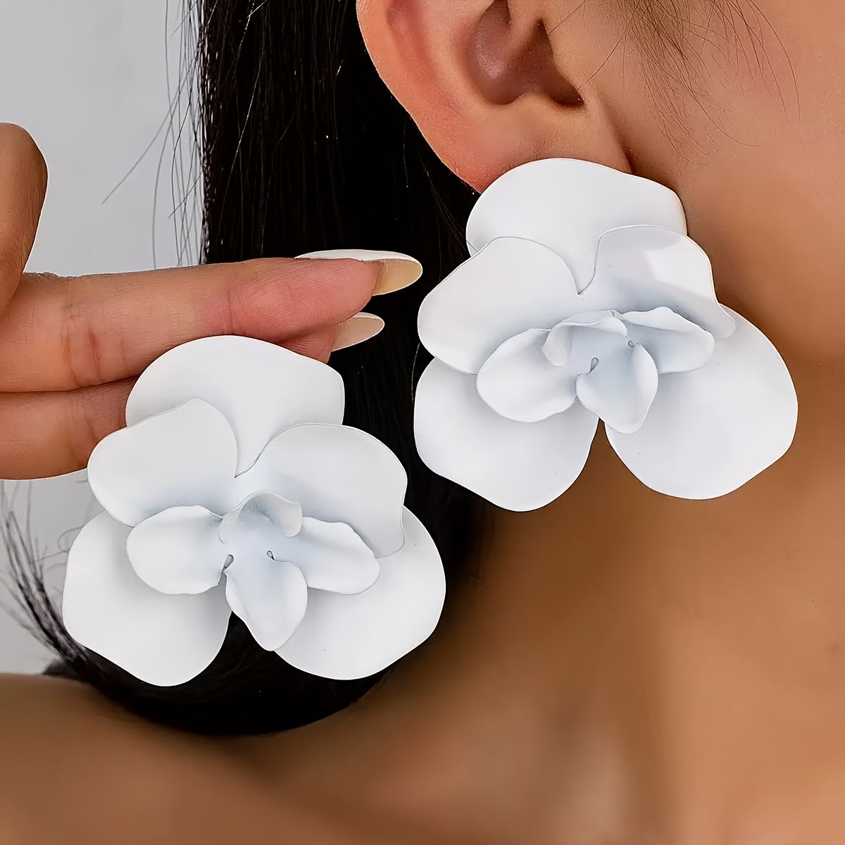 white flower earrings sold on Temu United States
