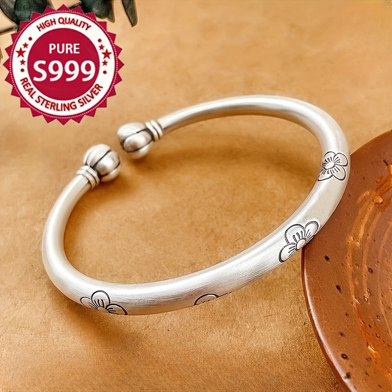 

A 999 Bracelet For Women With A Design And A -end Silvery Bracelet, Both In Chinese , Weighing 30g/1.05oz.