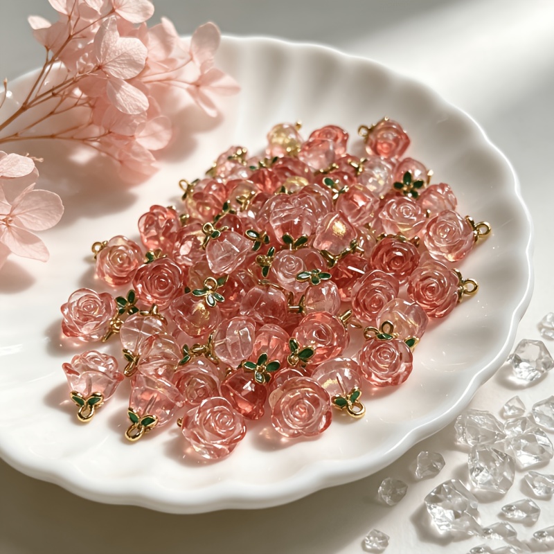TEMU Lot de 12 pendentifs en verre rose brillant de rose tridimensionnelle, avec sac en filet offert. Verre transparent + feuilles vertes émaillées