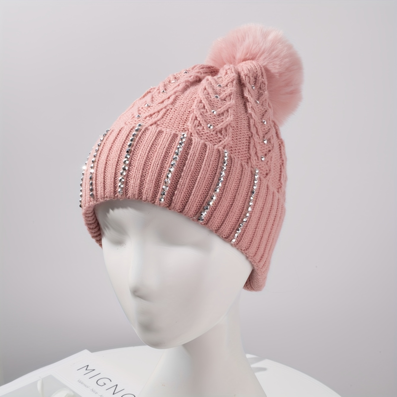 

Festive Pink Knit Beanie With Rhinestone Embellishments And Fluffy Pom Pom