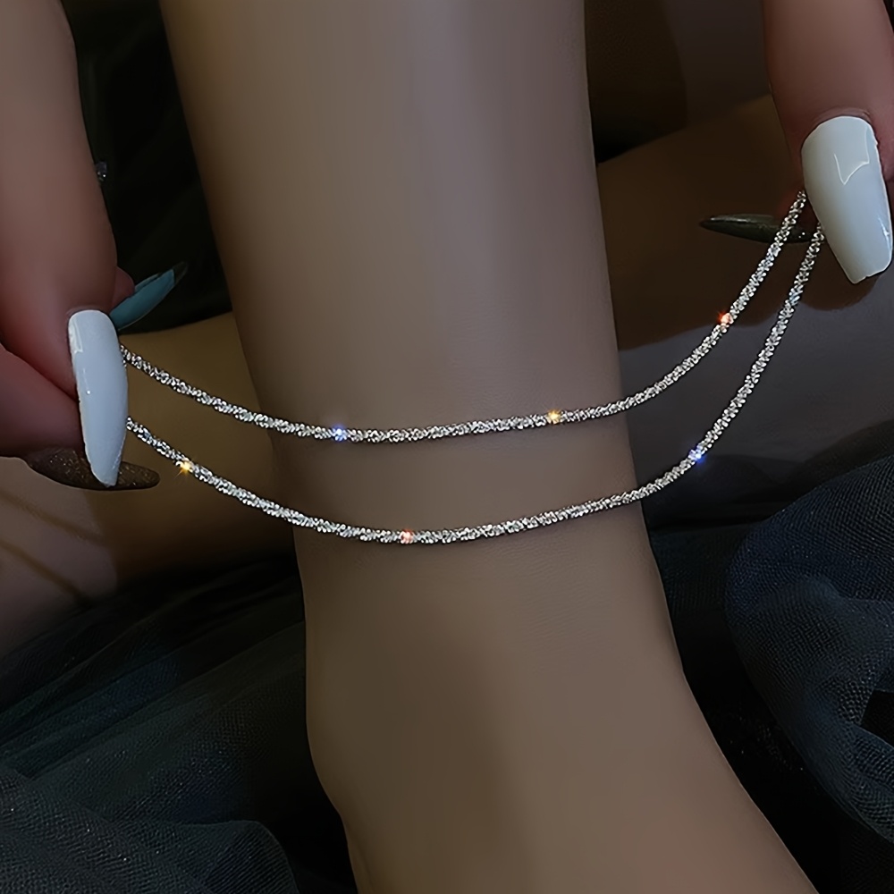 A Set Of 2 Elegant And Minimalist Layered Shimmering Chain Anklets For Women