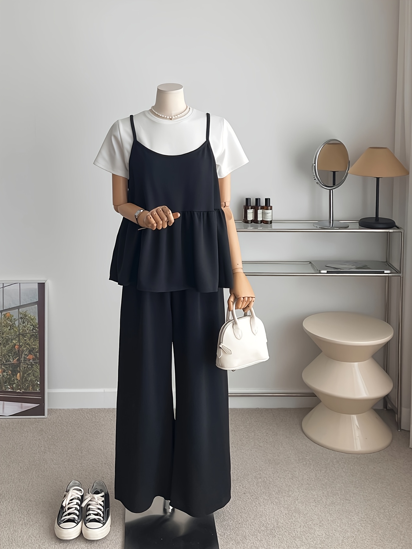 Effortless Chic Two Piece Set from Newness Flattering and versatile this stylish two piece set is perfect for everyday wear Model shown wearing the coordinating top and bottom in a neutral color palette