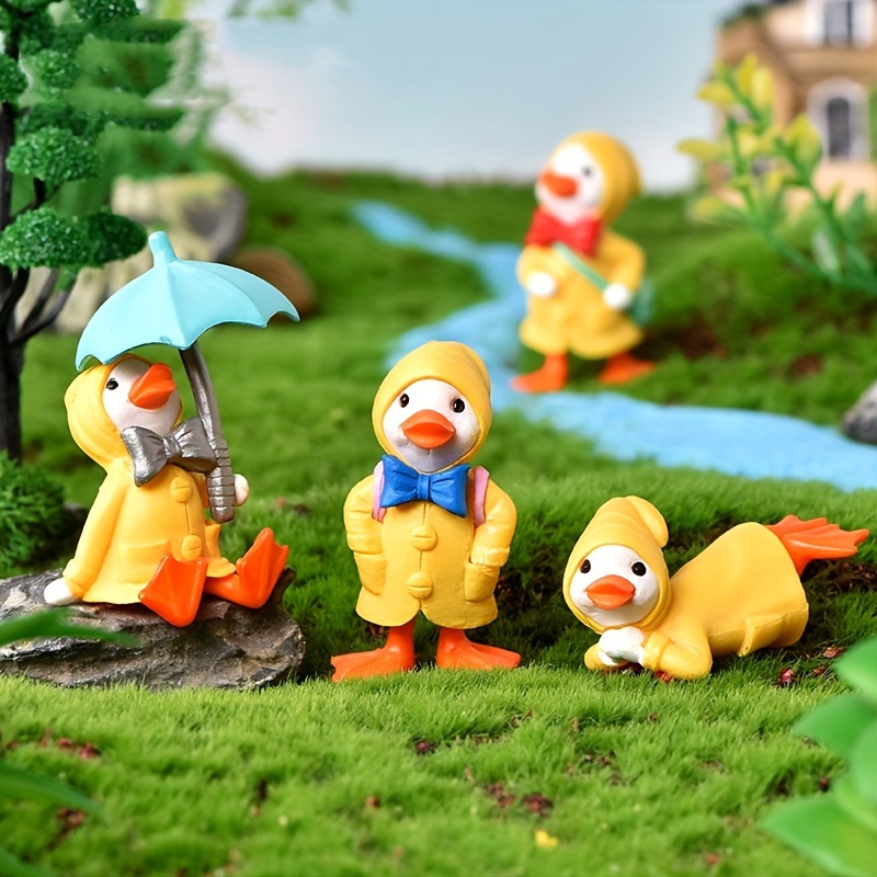 

4pcs Cute Cartoon Fun Raincoat Ducks, Horticultural Decoration Accessories, Pvc Cartoon Toy Doll Ornaments, Accessories For Birthday Gift Party Favors Eid Al-adha Mubarak