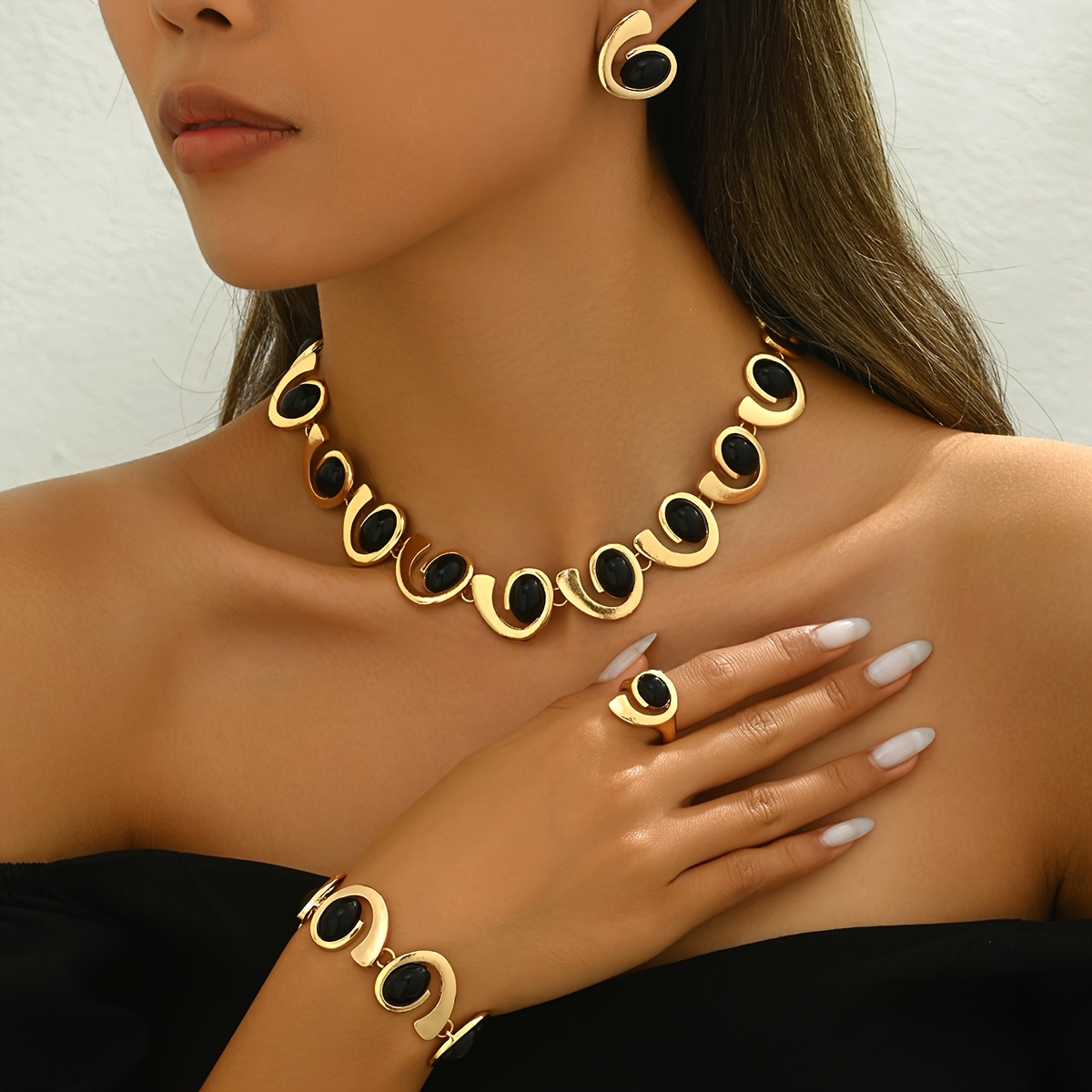 

Four-piece Women's Jewelry Set With Multiple Spiral, Snail, And Black Rhinestone On Necklaces, Bracelets, Earrings, And Rings. Classic And For Daily, Party, And Banquet Wear