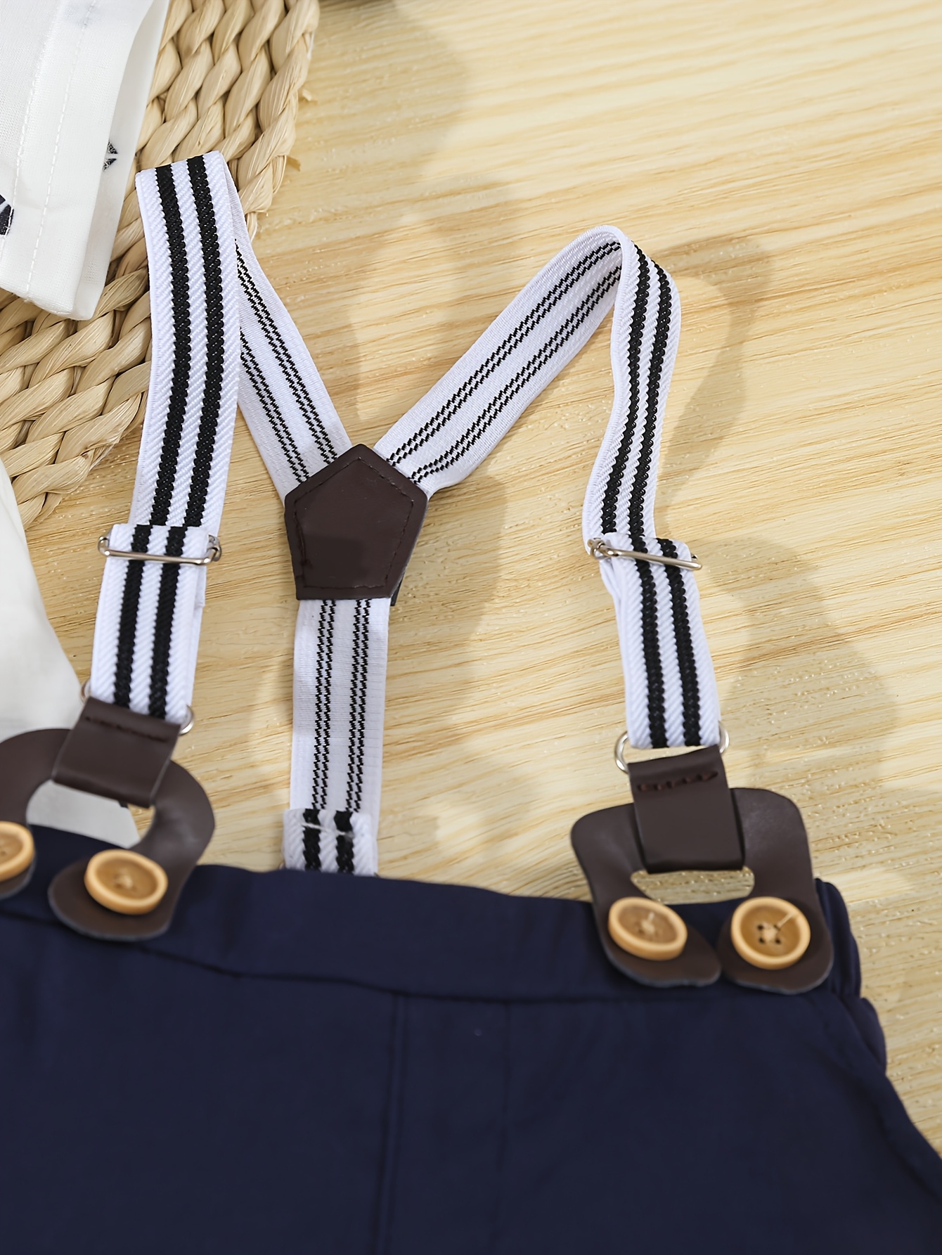 a formal three piece gentleman outfit for baby boys featuring a short sleeve shirt with geometric patterns and a bow tie shorts with suspenders and a   hat stylish and   its a   for summer birthday parties Product details 6