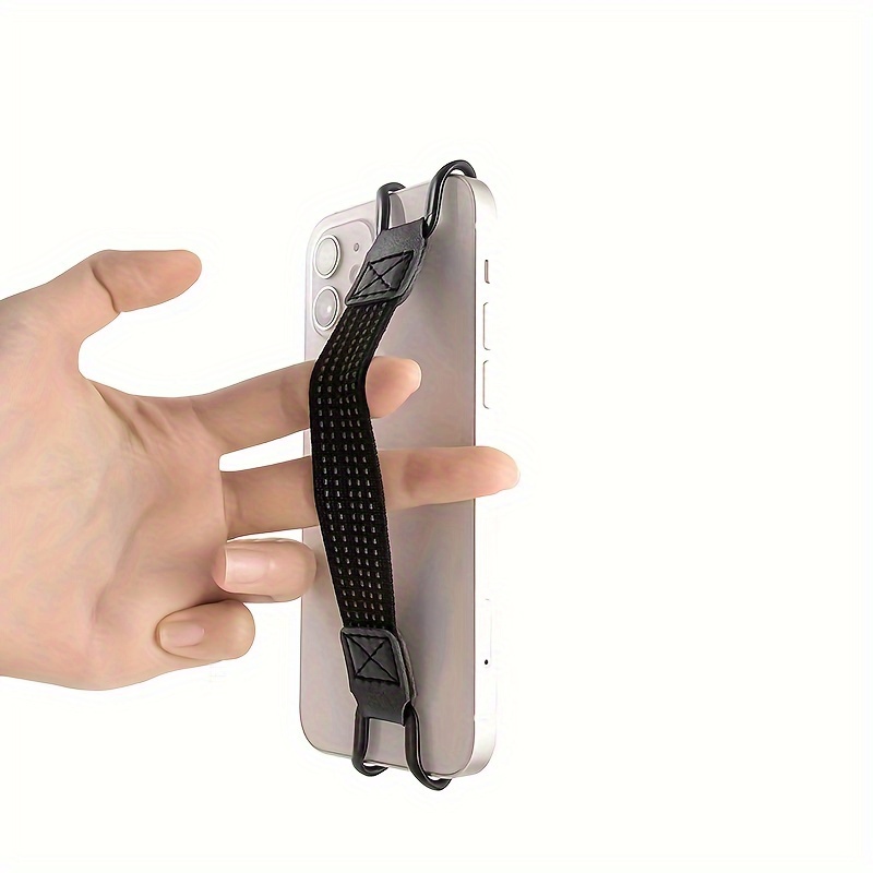 a portable phone holder with a non slip strap for one handed operation