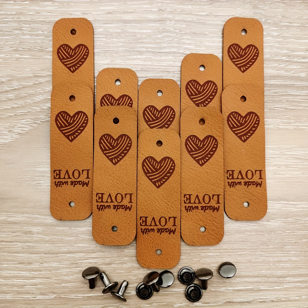 E-shop 10 personalisierte Kunstleder-Etiketten mit 10 Nieten-Sets.