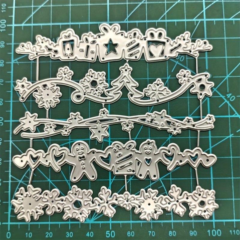 A Sheet Featuring Christmas Snowflakes, Handmade Christmas Cards, Metal Embossing Molds, And Carbon Steel Cutting Templates