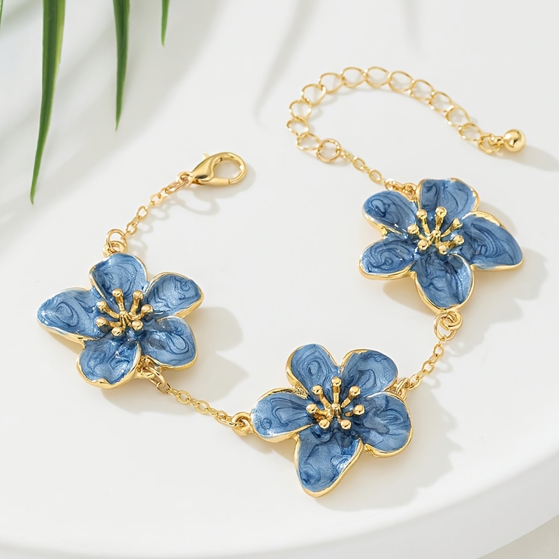 Image of A Women's Fashion Bracelet With A Style, Featuring An Exquisite Design Of Blue Drip-painted Five-petal Flower Shapes. Ideal As A Wedding Gift, Suitable For Travel, Vacations, Or Music Festivals