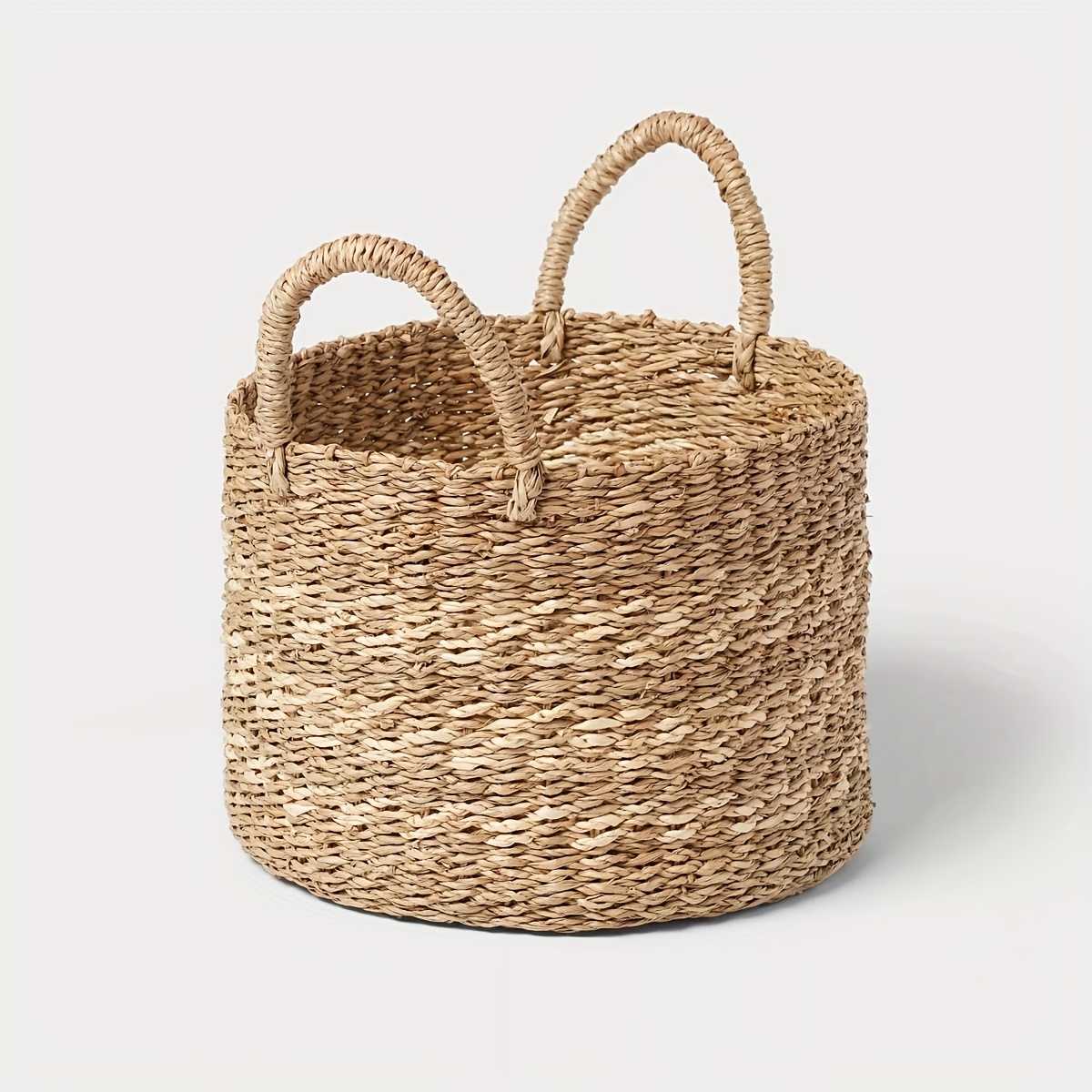 natural woven round basket with seaweed palm leaf stripes open   for     handles for portability   blankets pillows home decor storage storage basket laundry baskets