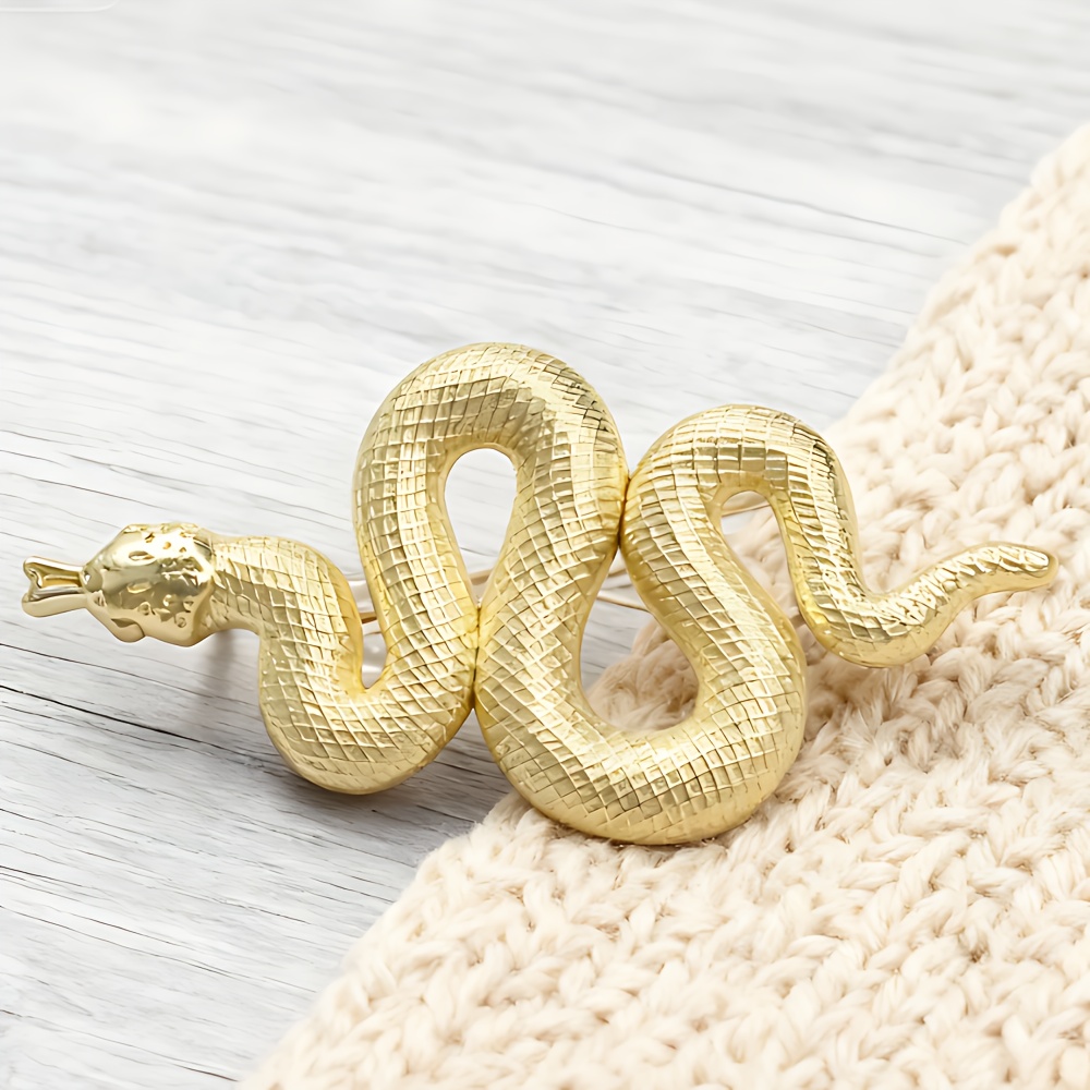 Image of Golden Jewelry Pin With Snake Motif. A For Fashion- Individuals. It At High-end Events To Display A And Daring Style. Zodiac Ornaments For The Year Of The Snake