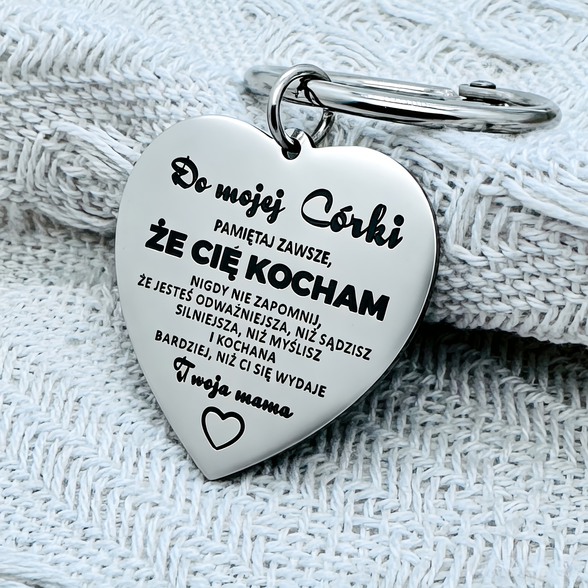 Image of A Metal Keychain, Engraved With An Inspirational Message In Polish, "to My Daughter! Remember, I Love You. , You Are , Stronger, And More Than You . Your Mom, " A Gift From A Mother To Her Daughter