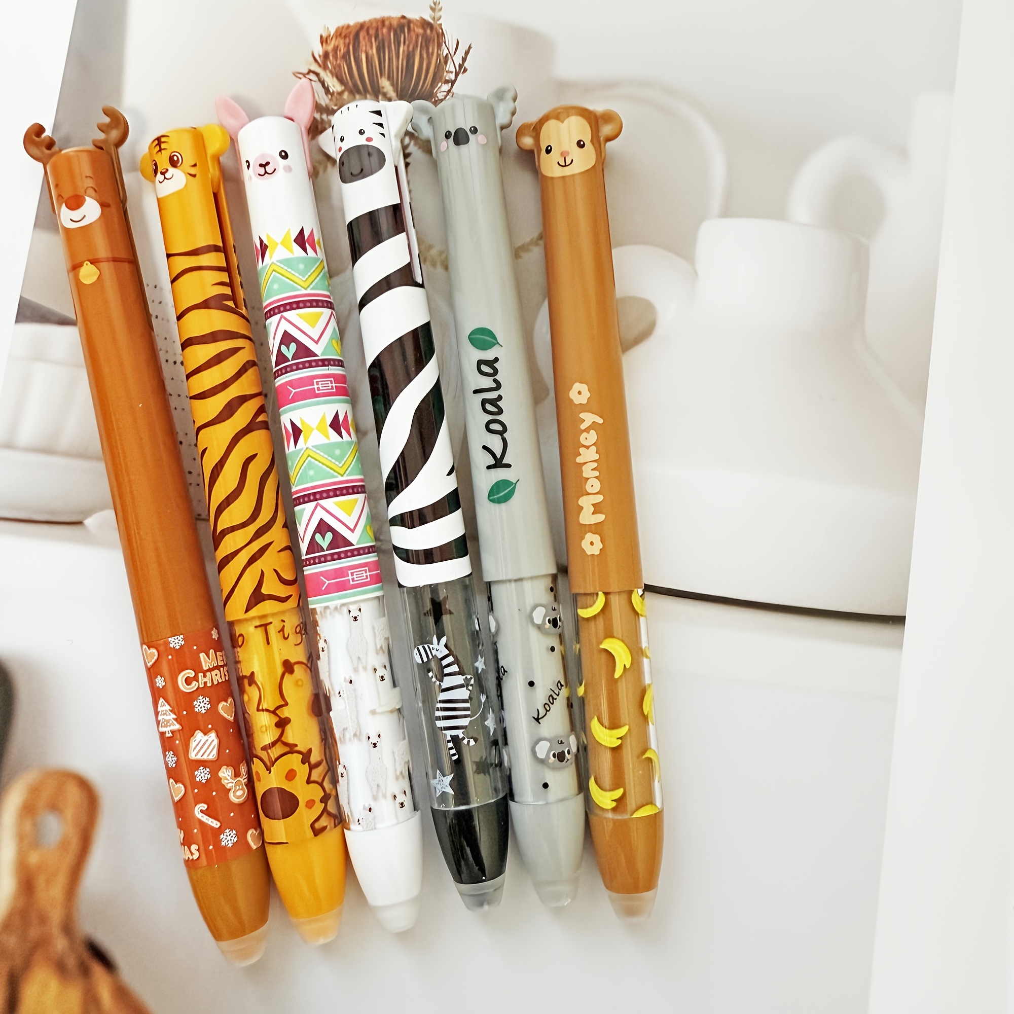 set of 8 adorable gel pens featuring a zoo theme each with dual colors of blue and red ink   clear double retractable pens come with an eraser providing a smooth writing experience ideal for journaling and office or school use Product details 2