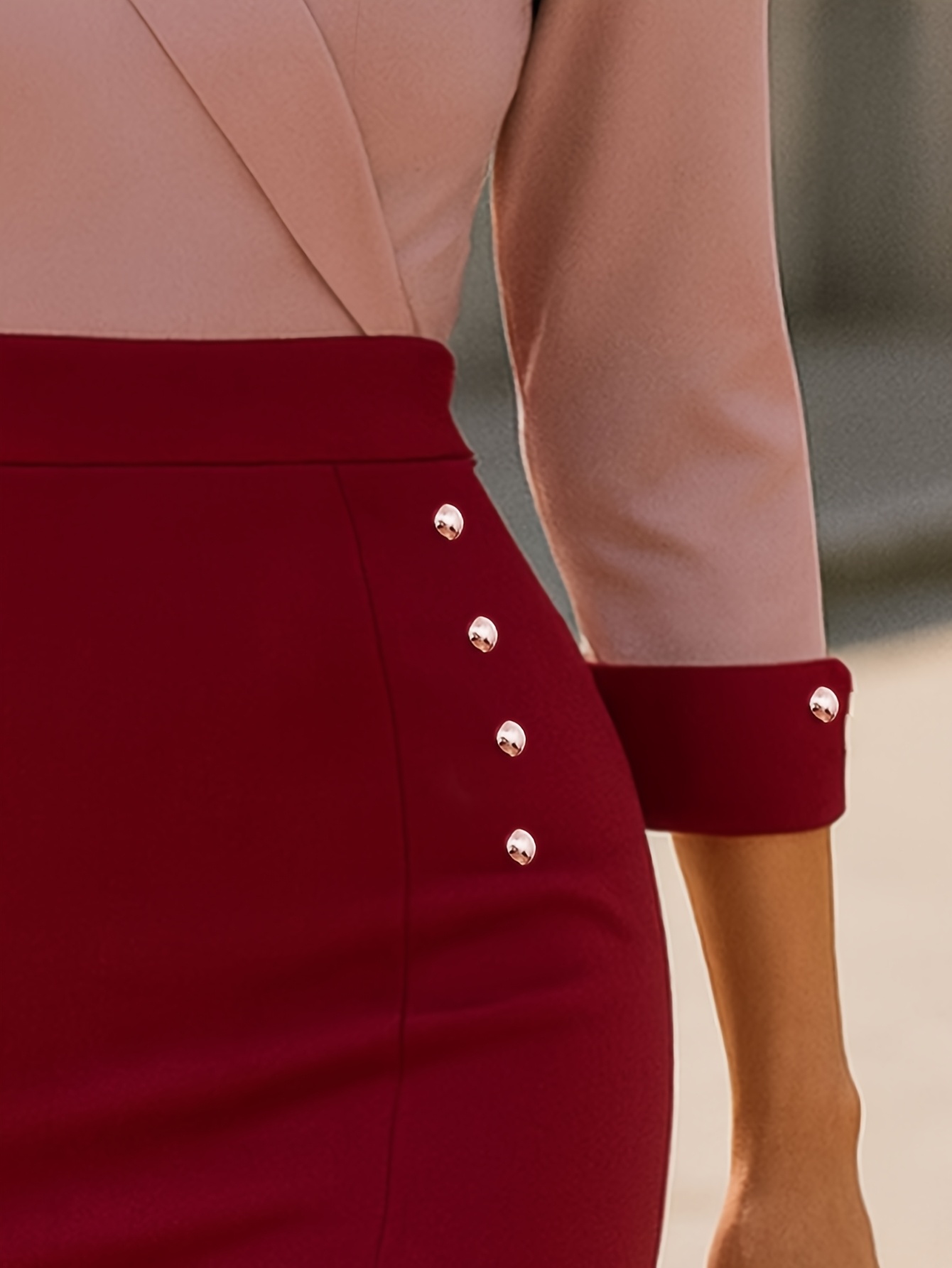 An Elegant Mid-Length Dress for Women in Autumn And Winter, Featuring a Faux Wrap Design with Three-Quarter Sleeves, a V-Neck, Contrasting Colors, a Slit Detail, And Decorative Buttons, Suitable for Both Casual And Office Wear