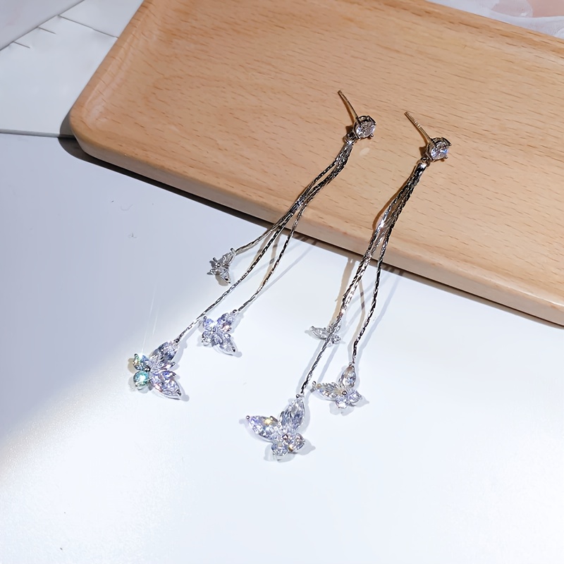 TEMU Paire de boucles d'oreilles longues papillon en synthétique super brillante, temperament de luxe léger