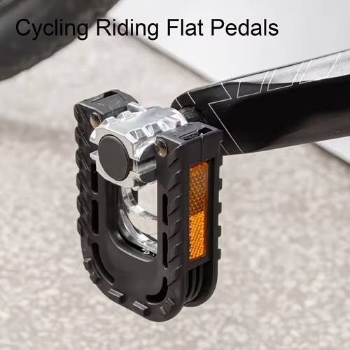 a set of black aluminum alloy folding bicycle pedals designed for mountain bikes featuring anti slip and a labor saving mechanism complete with safety reflective sheets