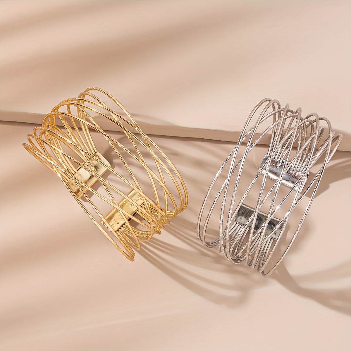 

A Stylishly Designed Golden Bangle With A Twisted Open End.