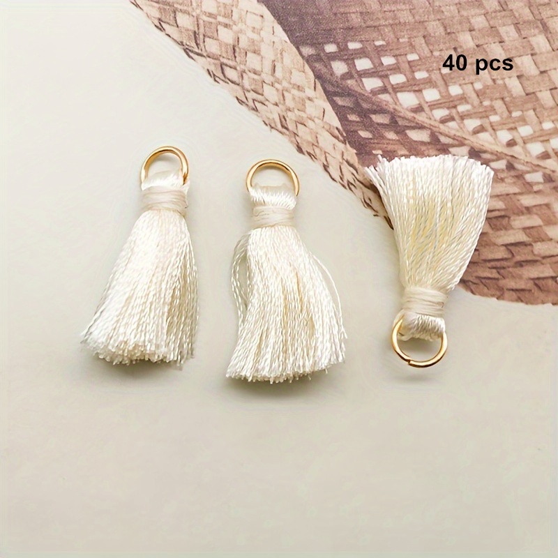 TEMU 40 piezas por paquete, color mezclado aleatorio de 2.5 cm, anillo de metal, borla de color sólido, borla de poliéster, marcador de borla,