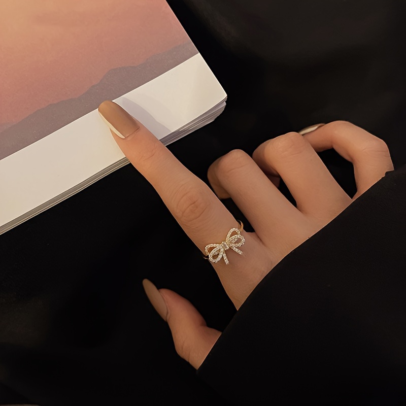 Golden Tone Bow Knot Ring with Sparkling Cubic Zirconia Accents