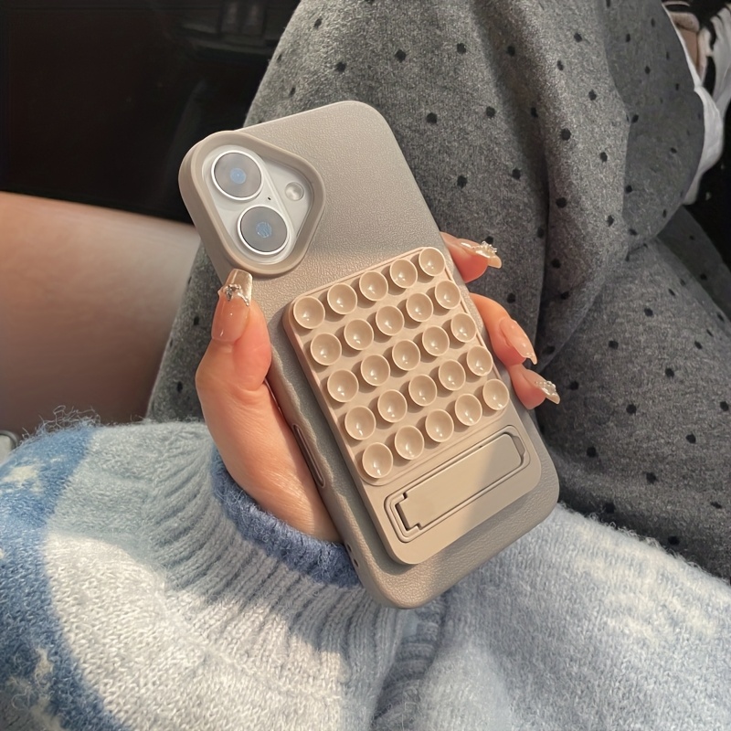 One-Piece Silicone Suction Cup Holder with Phone Case, Multifunctional Folding Desktop Stand, Strong Adhesion to Smooth Surfaces, Comfortable Grip Available in Pink, Grey, and Black Colors, Suitable for Apple iPhone Models X, XR, Max 11, Pro 11ProMax, 12, 12Pro, 13, 14, 15 Series