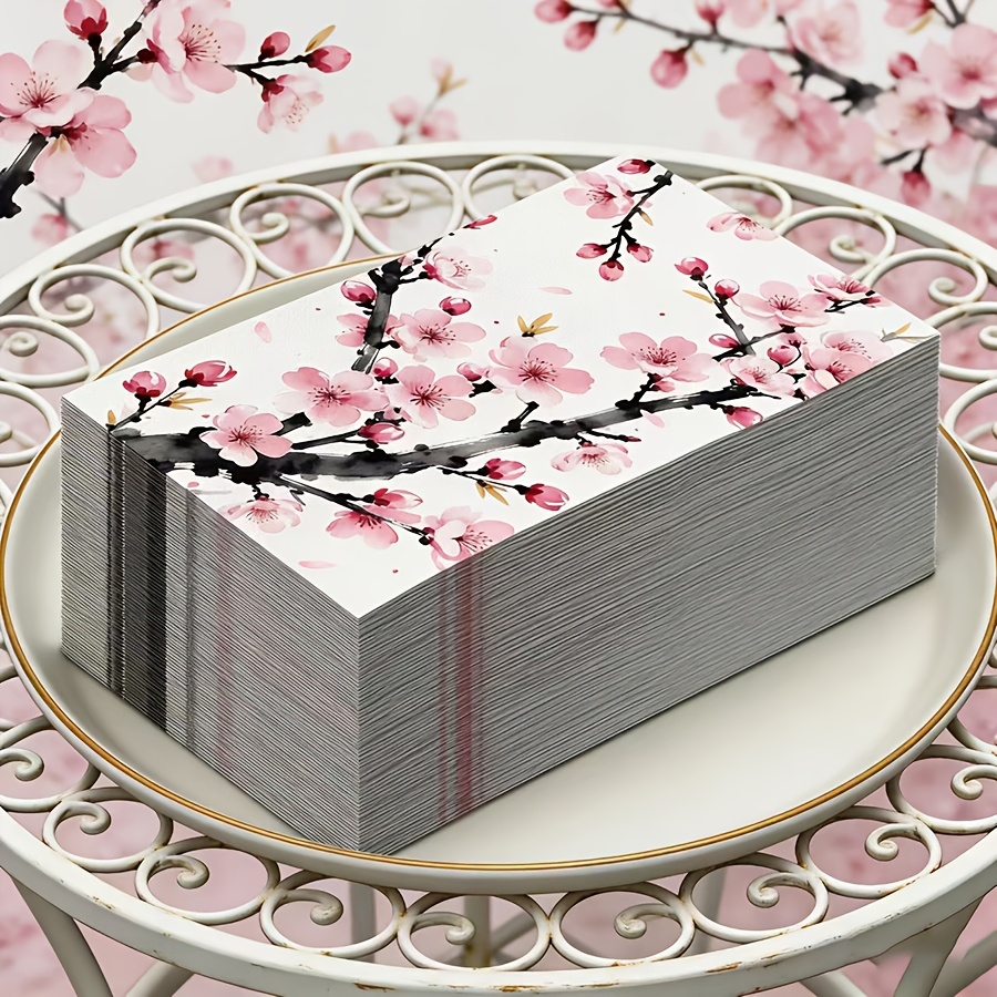 TEMU ensembles de serviettes de table jetables ornées d'un motif à l'encre de fleurs de pêcher. L'œuvre d'art met en valeur des branches roses et