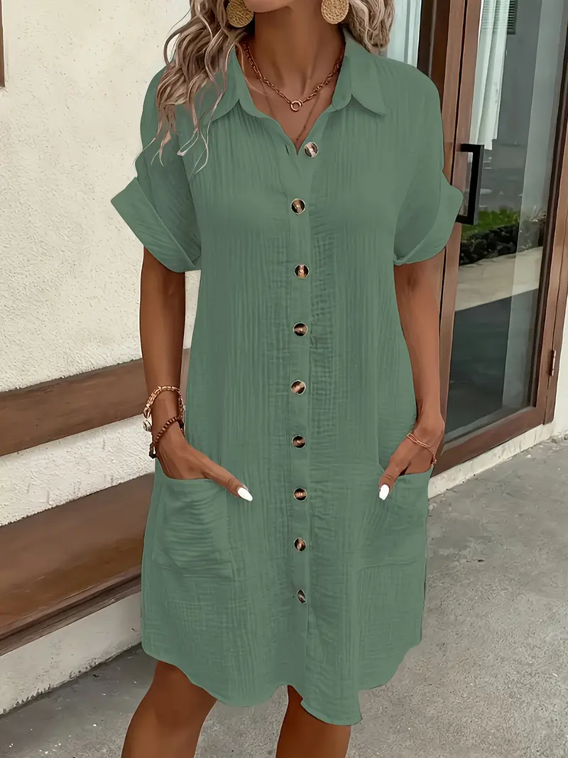 a minimalist white shirt dress made of breathable featuring a sharp collar design and buttons that add a touch of details 12