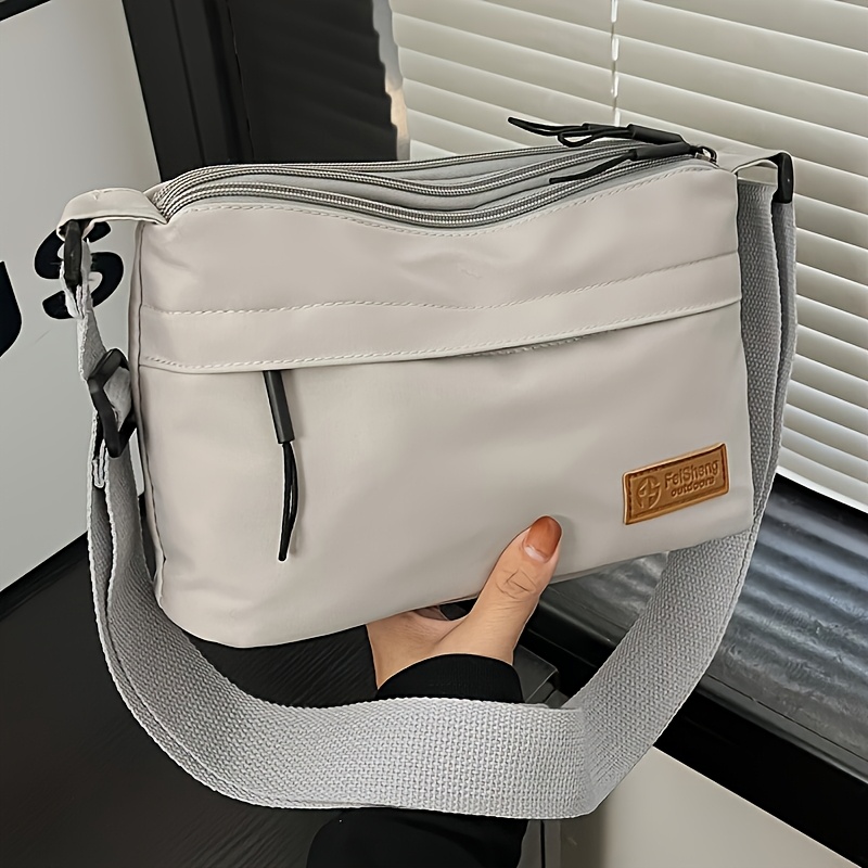 TEMU New Nylon Fabric Versatile Crossbody Bag With Multiple Pockets And Zippers, A Stylish And Casual Women's Shoulder Bag. Features An Adjustable