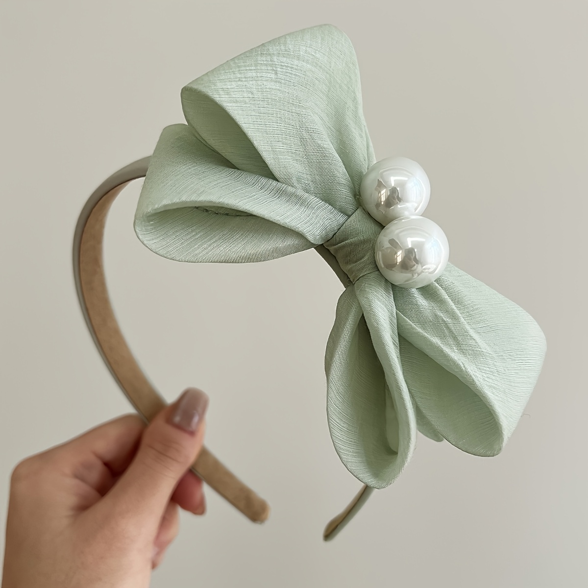 Image of Elegant Bow Headband With Round Shiny Accents In Soft Fabric Women's Stylish Hair Accessory For Party And Daily Wear